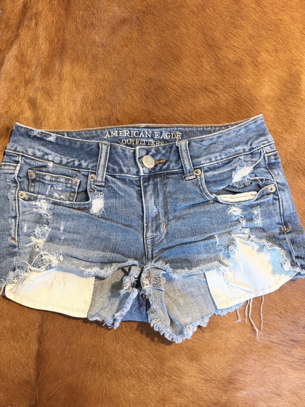 American Eagle Outfitters faded blue distressed jean shorts